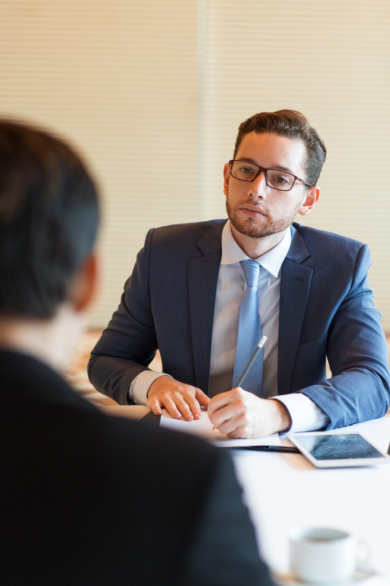 serious-manager-interviewing-applicant